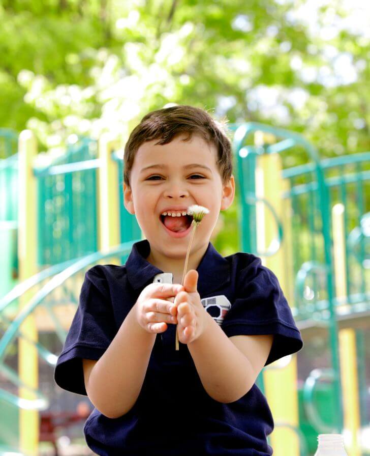 Cheerful young boy in a playground