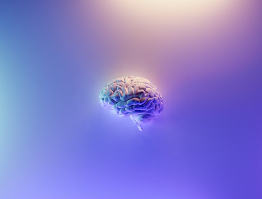 Illustrated brain glowing in purple light