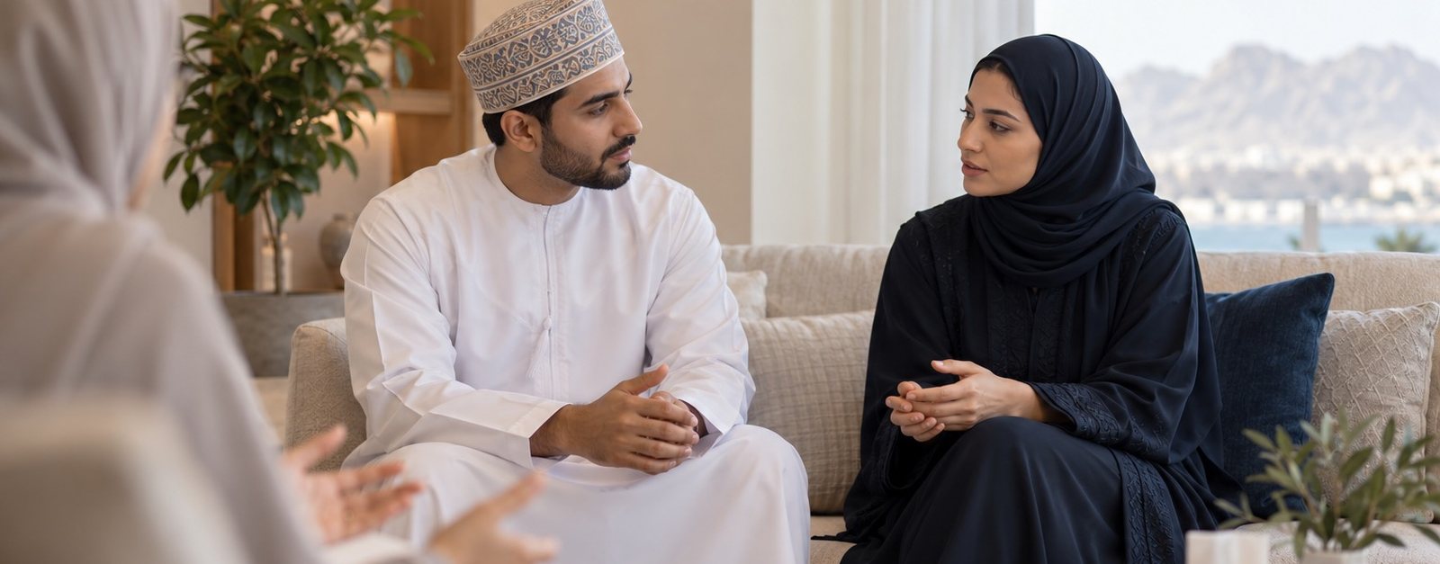 Husband and wife talking during a couples session with a therapist